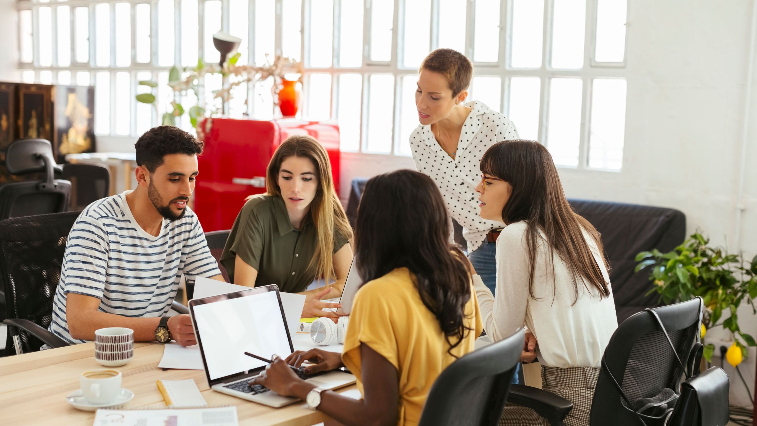 Group of five people planning their project