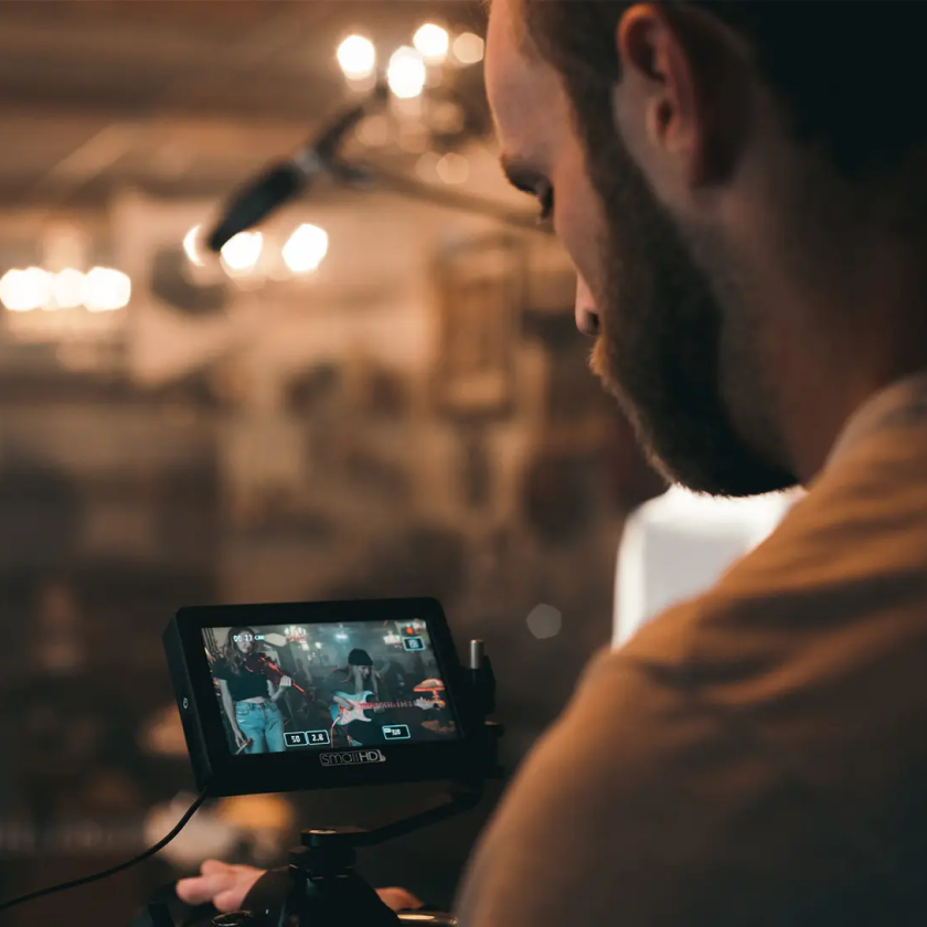 A person recording a music video, which will require compression.